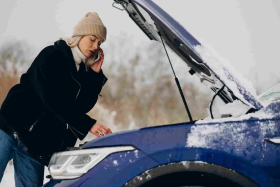 Young Woman Calling Phone After Her Car Brokedown Winter Season